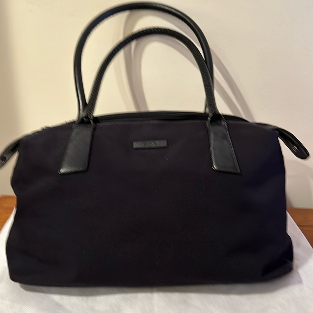 Canvas and Leather black Tumi Purse roomy 15x10x5 inches.